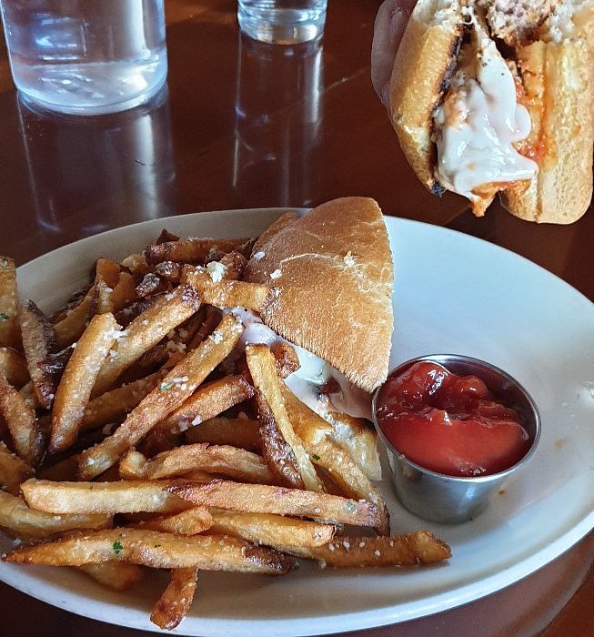 Noni's Bar & Deli signature dishes "The Noni" Sandwich (Prosciutto, Mozzarella, Basil)LasagnaGarlic FriesMeatball Sub